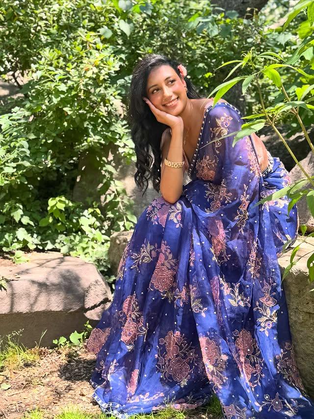 Sapphire Bloom — royal blue embroidered saree in the garden